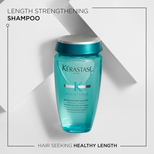 Een fles Kérastase shampoo voor het versterken van haarlengte en een gezonde lengte.