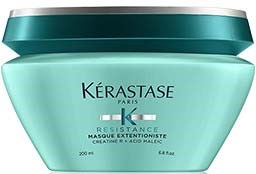 Lichtgroene pot met Kérastase Resistance Masque Extentioniste voor haarverzorging, met een donkergroene deksel.