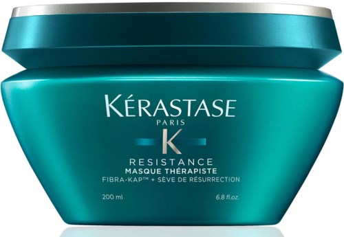 Een blauwgroene pot met Kérastase Resistance haarmasker, zilveren deksel en witte tekst.