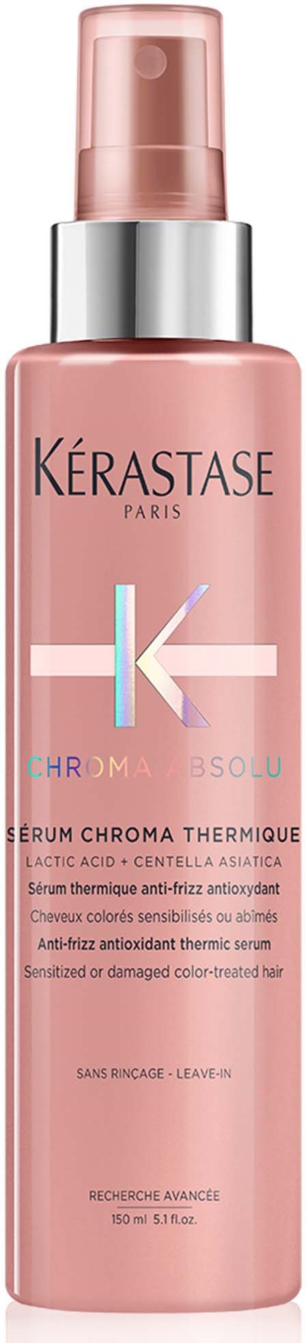 Roze fles met zilveren en blauwe details, gelabeld Kérastase Paris, haarserum.