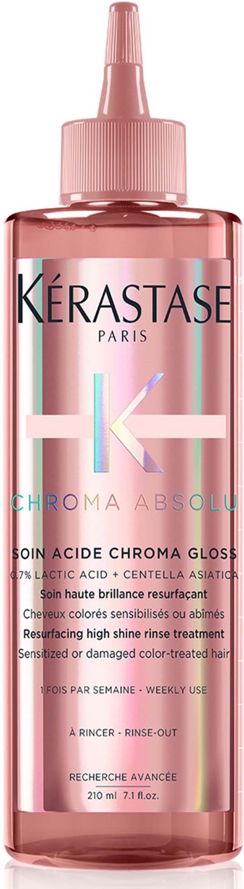 Roze fles met Kerastase Chroma Absolu haarglans bewerking met puntige dop.