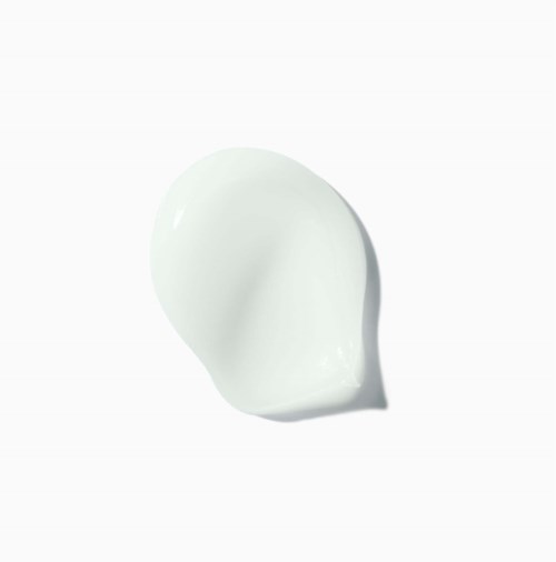 Een witte, gladde, ronde klont met schaduw, lijkt op een dot room of lotion.