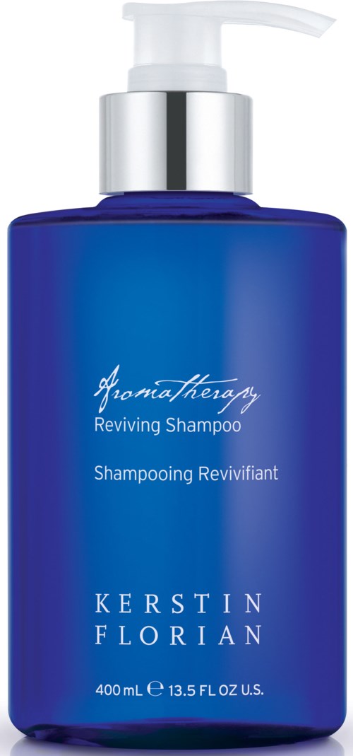 Blå flaska med vit pump, märkt som Reviving Shampoo av Kerstin Florian.