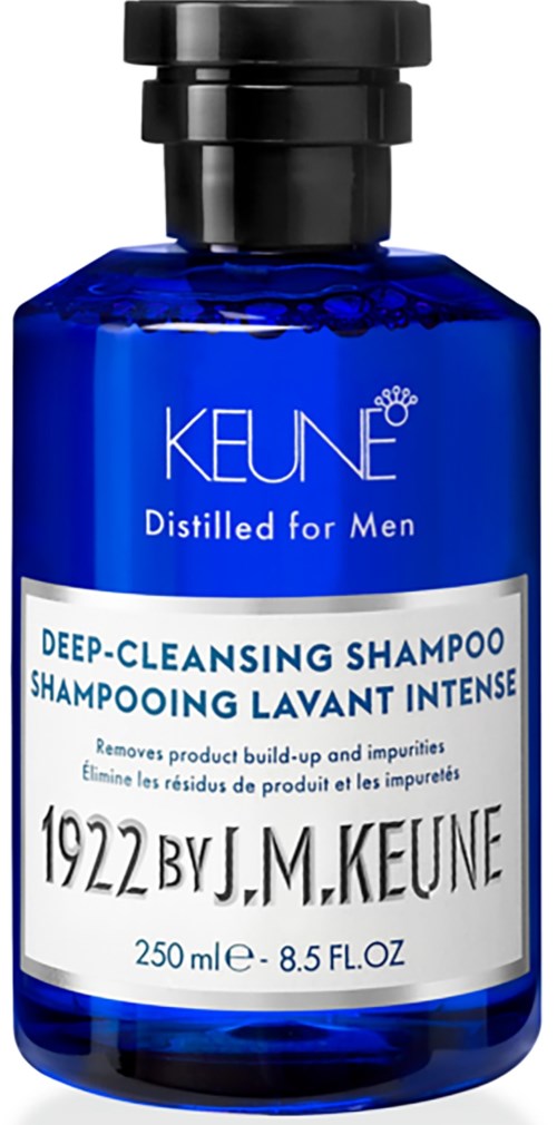 Blue bottle of Keune men's deep-cleansing shampoo with white and black text, and black cap.