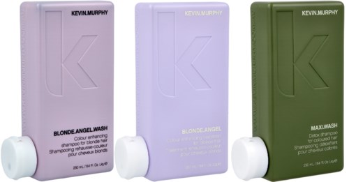 Three shampoo bottles in purple, lavender, and green, with white caps and text labels.