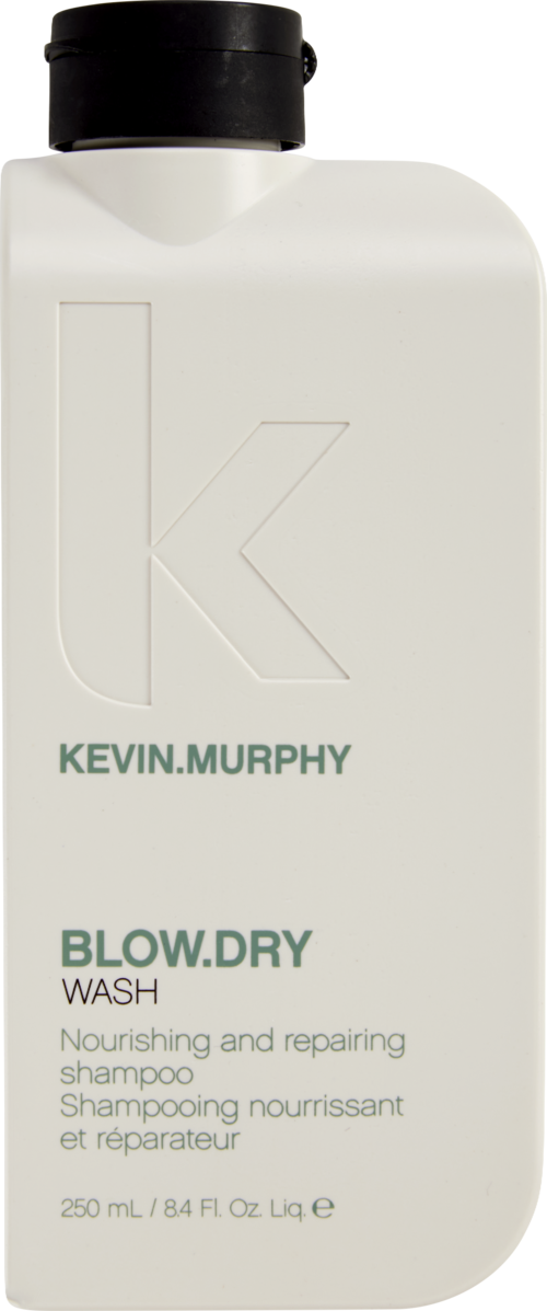 A white bottle with black cap labeled Kevin.Murphy Blow.Dry Wash, 250 ml, for nourishing hair. 