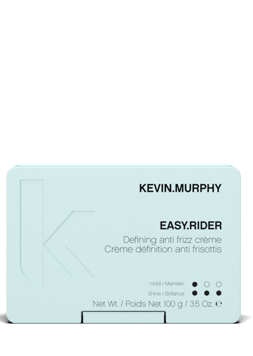 Liten lyseblå boks med svart og hvit tekst, nevner Kevin Murphy Easy Rider anti-frizz krem og netto vekt.