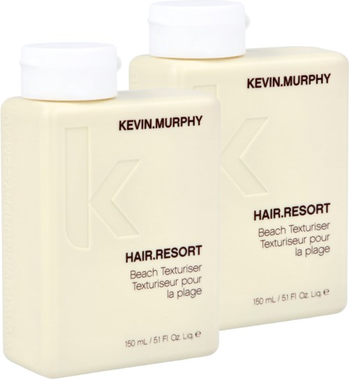 Two bottles of beach texturizer labeled Kevin Murphy, with white caps, off-white bottles, and text in black and brown.