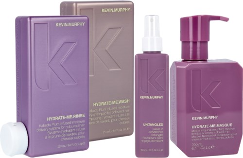 Ein Satz Kevin Murphy Haarpflegeflaschen und -boxen in Lila und Grau.