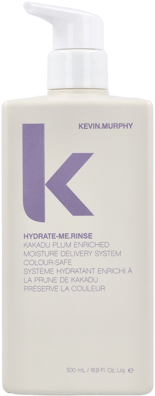 En vit flaska med pump märkt Kevin Murphy, designad för hårvård, rymmer 500 ml, med lila och svart text.