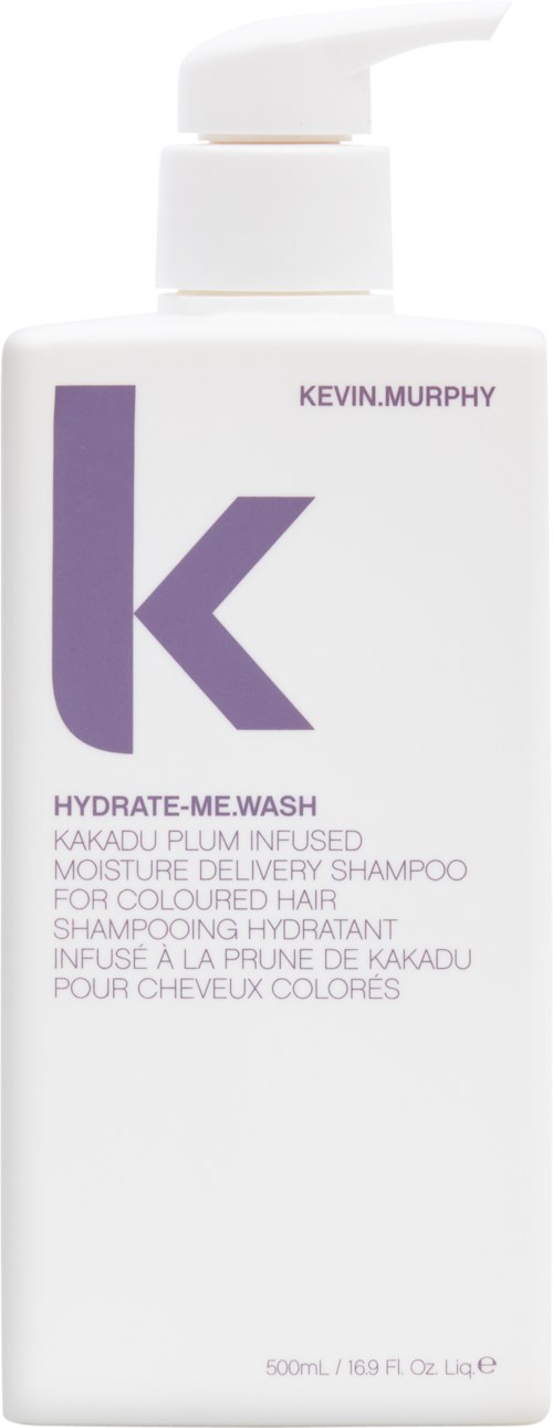 En vit schampoburk med en lila "k" logga och text för Kevin Murphy Hydrate-Me.Wash.