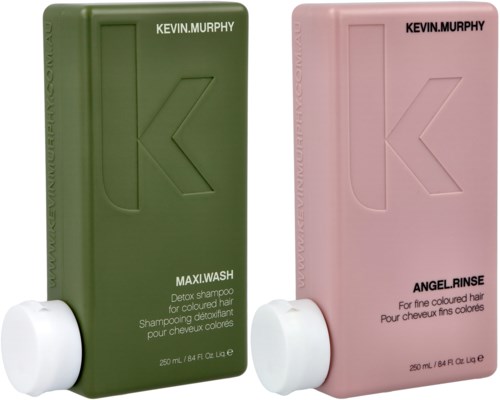Two hair care bottles, one green for shampoo, one pink for rinse, with white caps and black text.