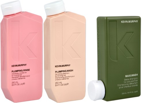 Three bottles of hair products: pink, beige, and green. Each has a large letter 'K' on the front.