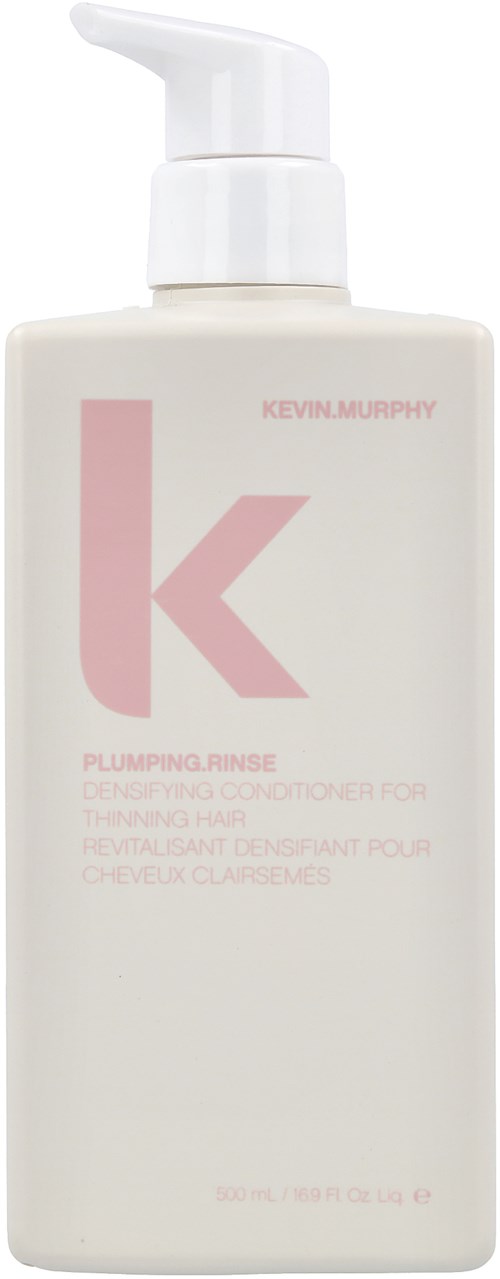 En vit flaska med pump, märkt 'Kevin Murphy' och 'Plumping Rinse' för hårvård.