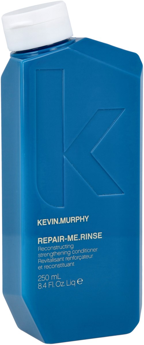 A blue shampoo bottle with a white cap, labeled Kevin.Murphy Repair-Me.Rinse, 250 mL capacity.