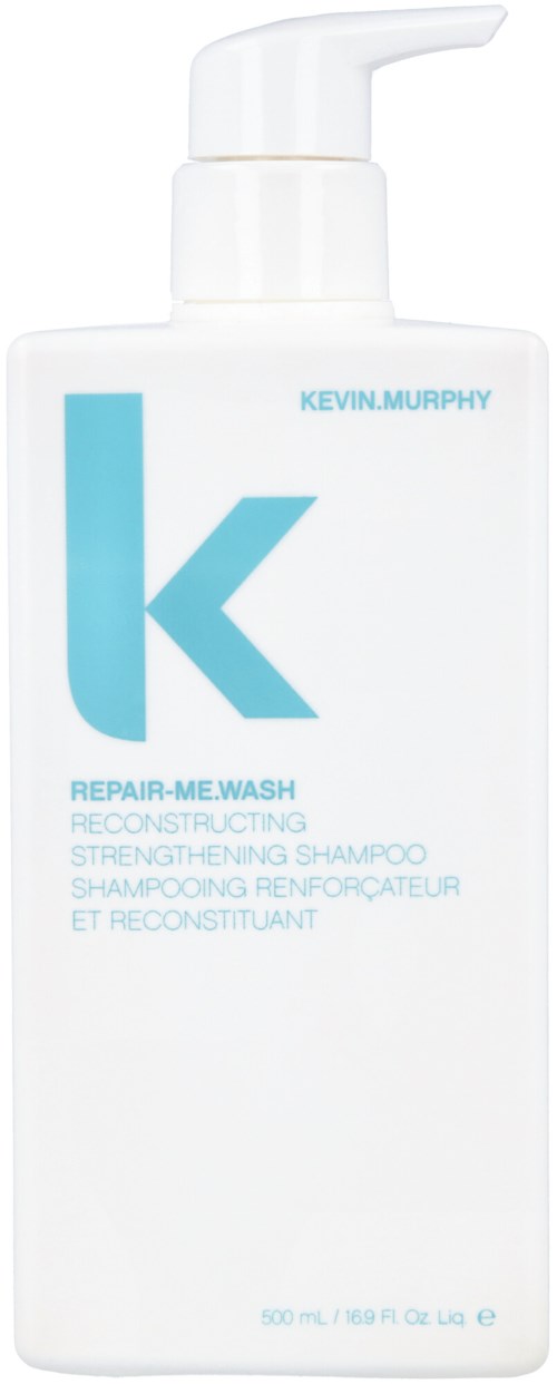 En vit schampoflaska med ett stort blått 'k' och text, märkt som Kevin Murphy Repaired Me-Wash för hår.