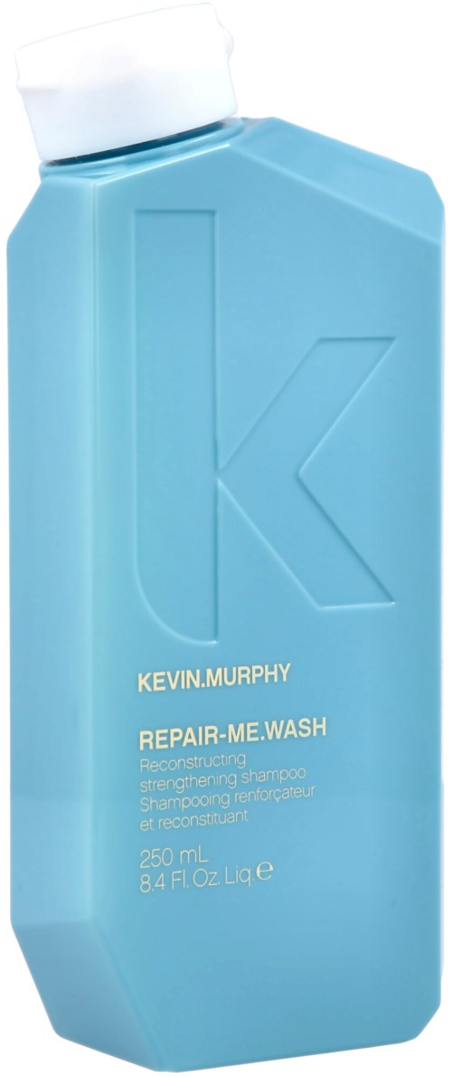 Shampoo bottle with a large letter K and text for Kevin Murphy repair product, 250 ml capacity.