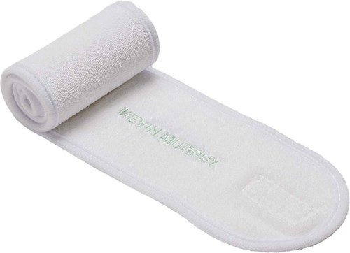 A white sports towel with Velcro, partially rolled up, with green text that says Kevin Murphy.