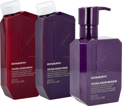 Drei Flaschen Kevin Murphy Haarprodukte in Rot, Lila und Dunkellila mit Pumpen.