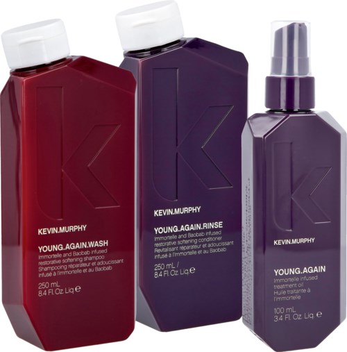 Drei Kevin Murphy Haarpflegespender in Rot, Lila und Lavendel mit weißen, lila und Lavendel-Deckeln.