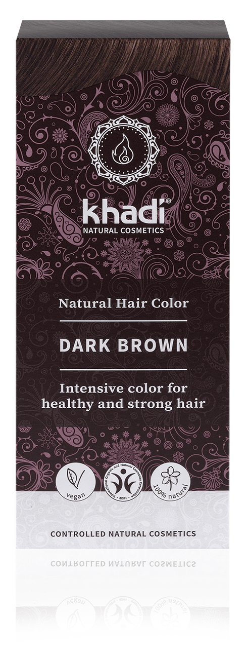 En eske med Khadi naturlig hårfarge i mørk brun farge. Den har en mørk lilla og svart design og ikoner for naturlige ingredienser.