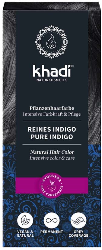 Svart eske med blå og lilla design, merkevaren Khadi, nevner Indigo hårfarge og naturlige, veganske ingredienser.