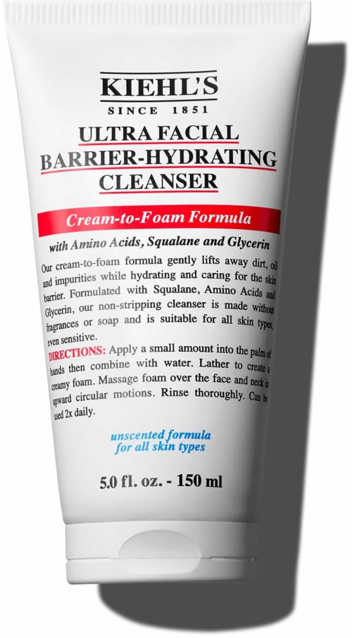 A white tube of Kiehl's facial cleanser, labeled as barrier-hydrating, with red accents and black text.
