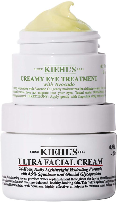 Kiehl's ihonhoitopurnukoita, ylin avoava kuhnan kanssa ja alempi Ultra Facial Cream, pinottuna.