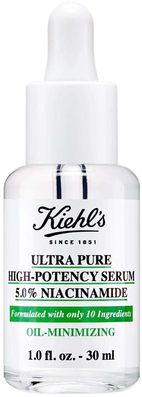 A white bottle of Kiehl's serum with a dropper cap, labeled for high-potency skincare with niacinamide.