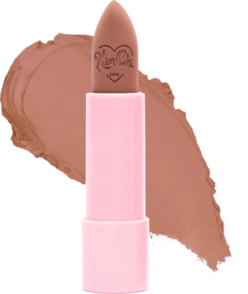 A brown lipstick with a pink case, smudged on a white background.