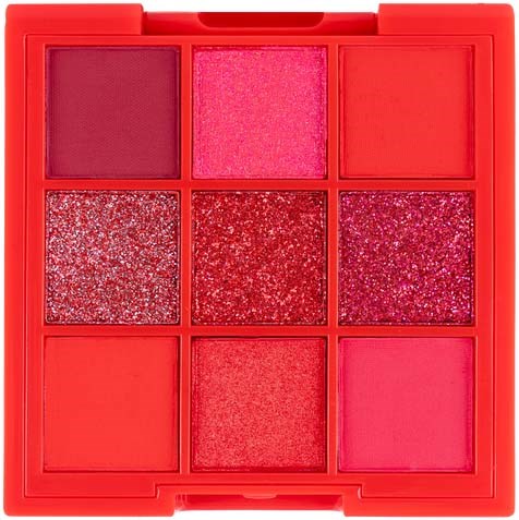 A red makeup palette with nine sections of pink and red shades, including matte and glitter eyeshadows.