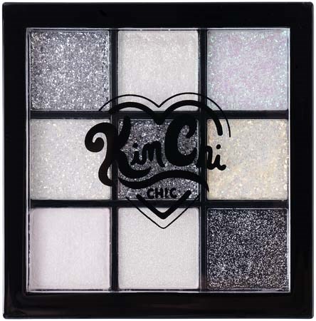 Box with nine sections of glittery eyeshadow shades arranged in a grid. Central logo with the words "Kiss Chic" inside a heart.