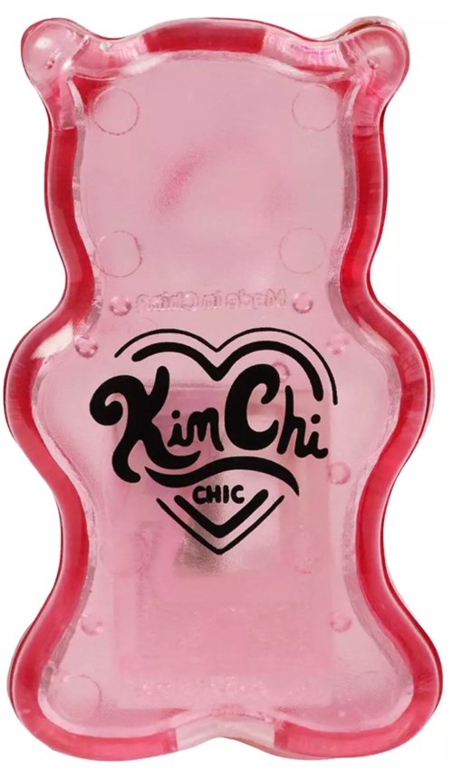 A pink gummy bear-shaped object with 'Kim Chi' and 'Chic' written on it in black text.