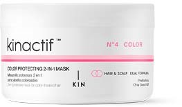 Een witte pot met 'kinactif' en roze en zwarte tekst, aangegeven een haarverf-masker, 2-in-1.