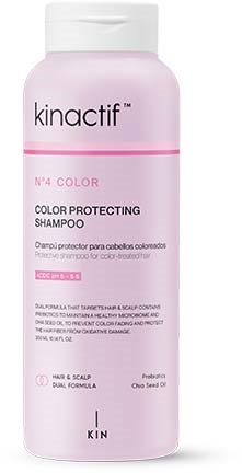 Een roze en witte shampoo flesje met 'Kinactif' voor kleurbescherming, bedoeld voor haar en hoofdhuid.