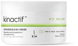 Een witte container met 'kinactif' en groene accenten, geeft aan dat het een haar- en hoofdhuidproduct is in een volume container.