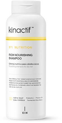 Een witte fles Kinactif Nutrition Rich Nourishing Shampoo met een gele streep, geschikt voor droog haar.
