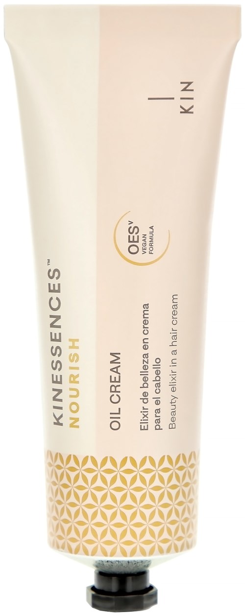 A tube of KIN ESSENCES OIL CREAM with a yellow and white geometric design, labeled as for oily skin, with a black cap.
