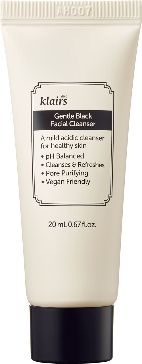 Een witte tube gezichtsreiniger met zwarte dop, gelabeld als Gentle Black Facial Cleanser, 20 ml, veganistisch.
