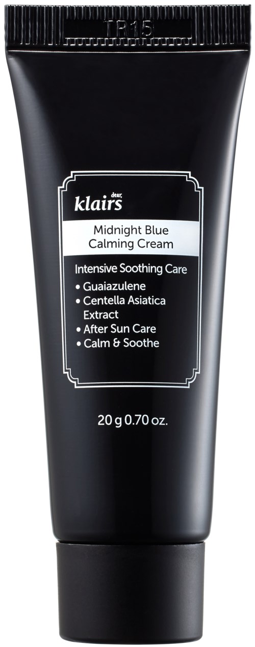 Een zwarte tube met de tekst "Midnight Blue Calming Cream" en details over kalmerende ingrediënten en gebruik.
