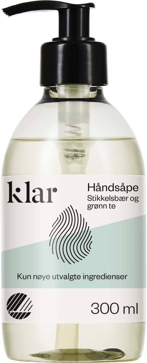 Duidelijke handzeepfles met zwarte pomp, gelabeld 'klar', met groene thee en lingonbär ingrediënten, 300 ml.