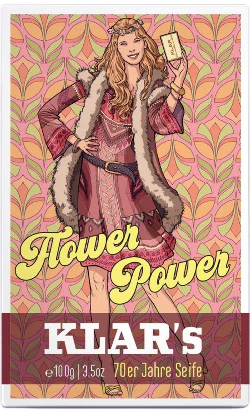 A woman in bohemian style clothes holds a soap bar, standing against a colorful, patterned background with the words "Hower Power".