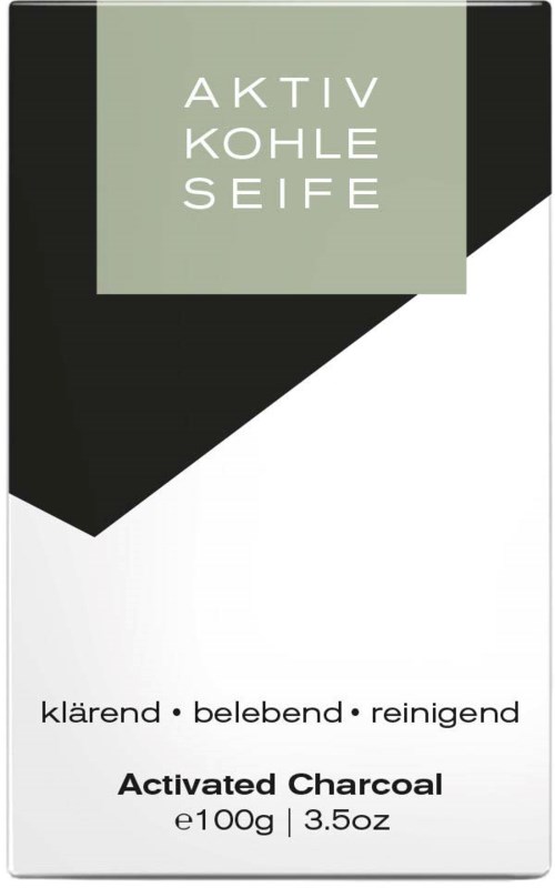A soap package with black, white, and light green colors, labeled as activated charcoal, 100 grams, designed for cleansing.