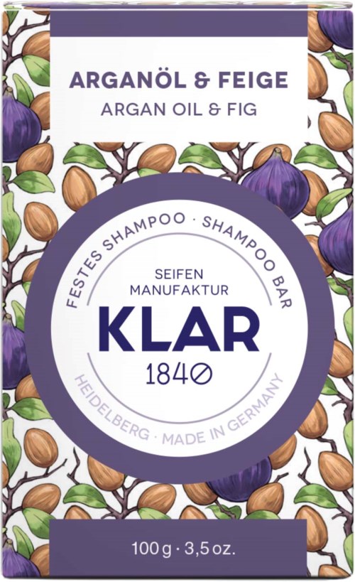 A shampoo bar package with argan oil and fig, decorated with illustrations of figs and nuts, indicating natural ingredients.
