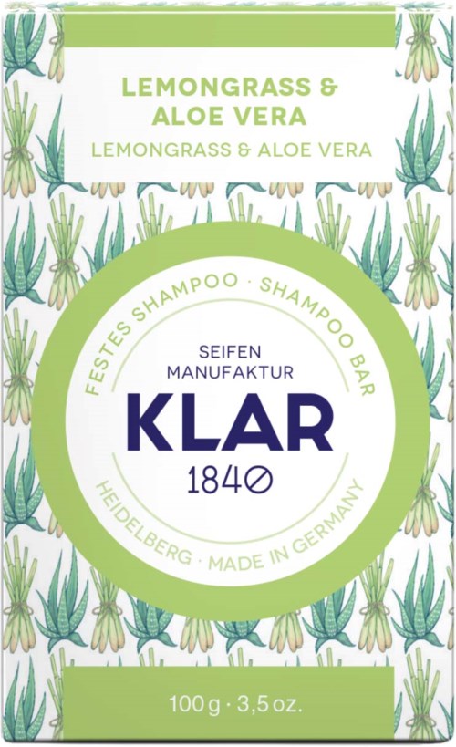 A shampoo bar packaging with green and purple text, featuring aloe vera and lemongrass illustrations, and branding details.