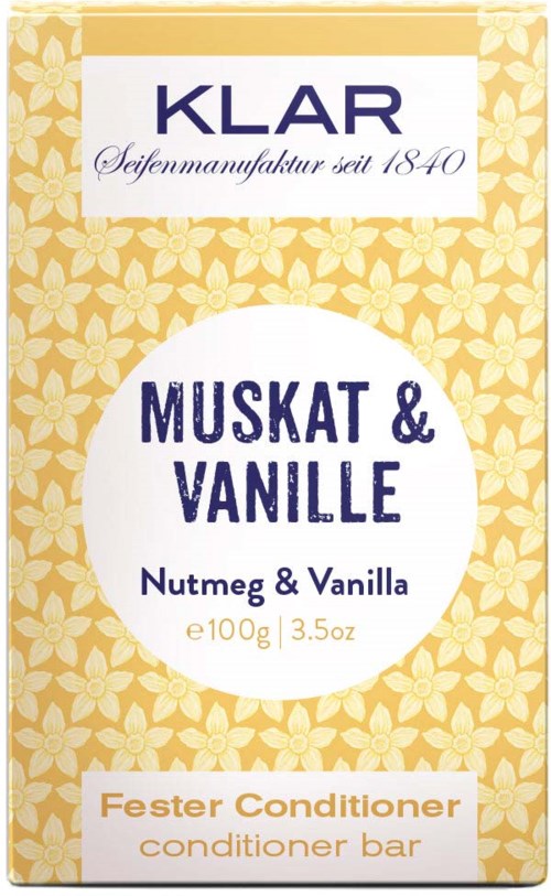 A box of chocolate soap with floral design, labeled 'KLAR', with scent 'Nutmeg & Vanilla', 100g. Conditioner bar included.