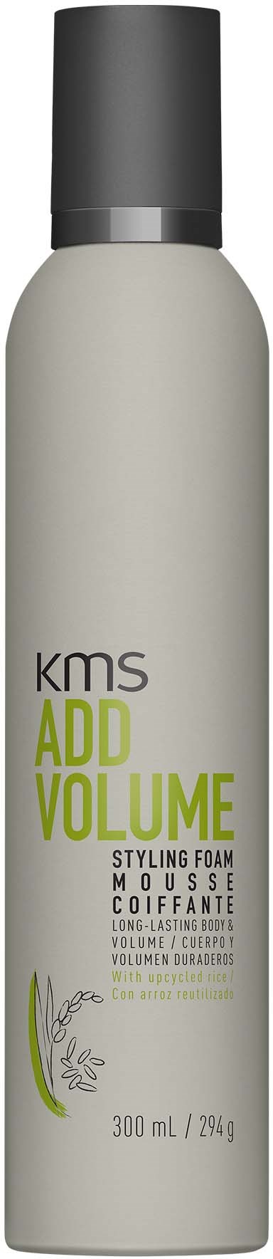 A tall, white can with a black cap labeled 'KMS Add Volume Styling Foam' for hair. Contains 300ml.