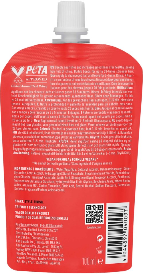 punainen pullo valkoisella korkilla, etiketti teksteineen ja viivakoodineen, todennäköisesti shampoo tai kosmetiikkatuote.