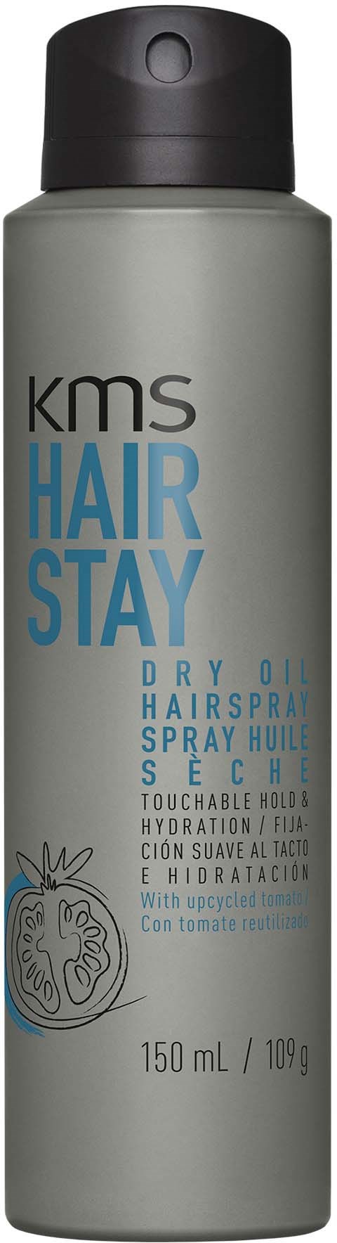 Grijs sprayfles met het label KMS Hair Stay, voor droog haar, met zwarte dop.