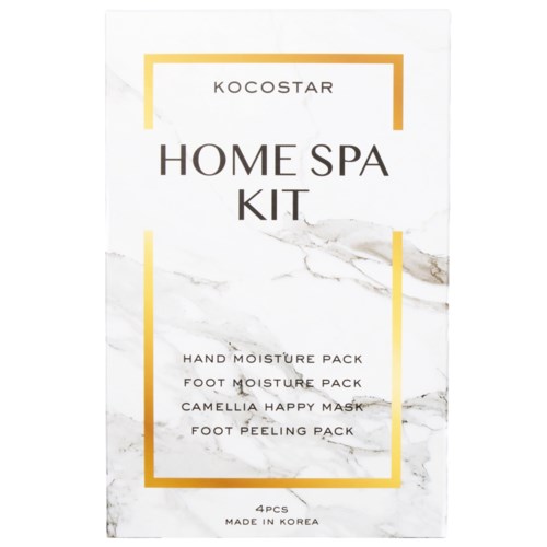 En hvit pakke med gullrammer og svart og gull tekst. Den sier "HOME SPA KIT" med en liste over produkter inni.
